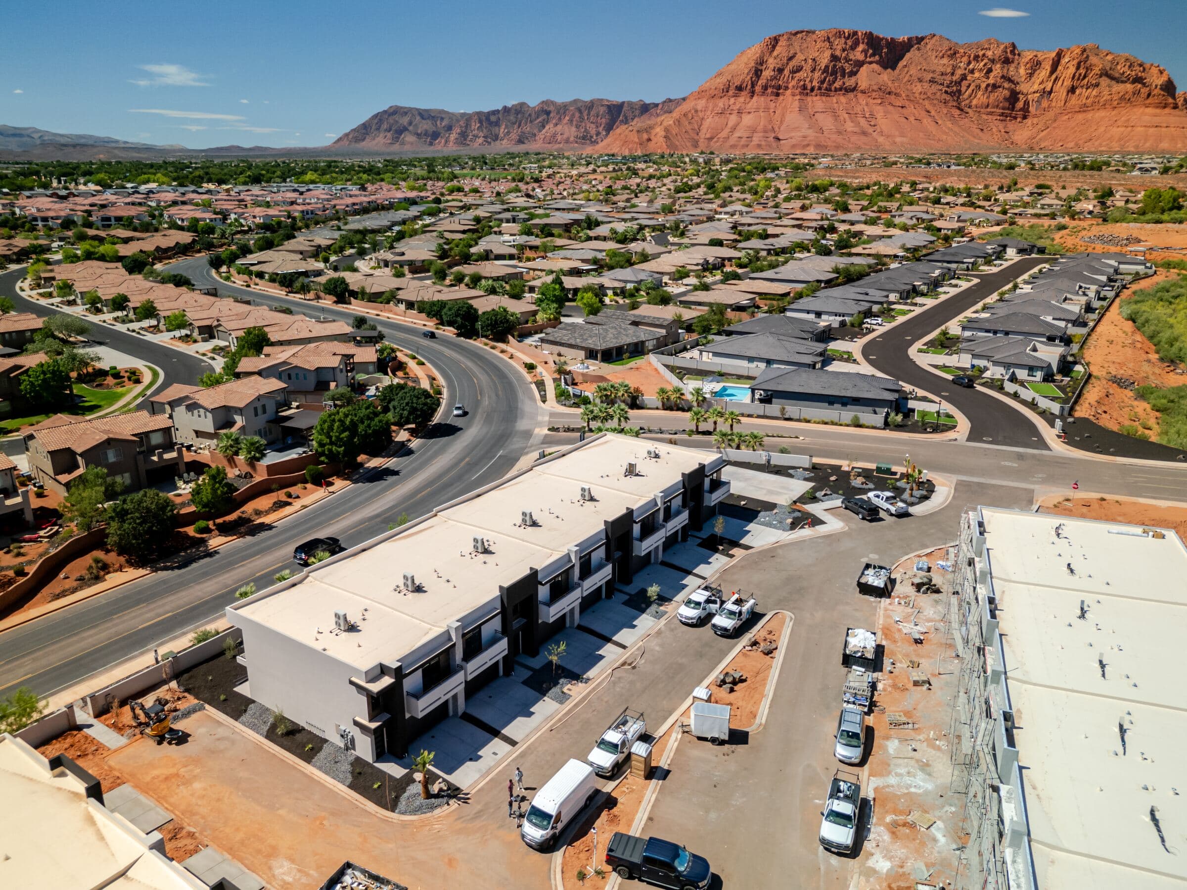 Aerial view of Solace Townhomes with Santa Clara red rock ridgeline behind