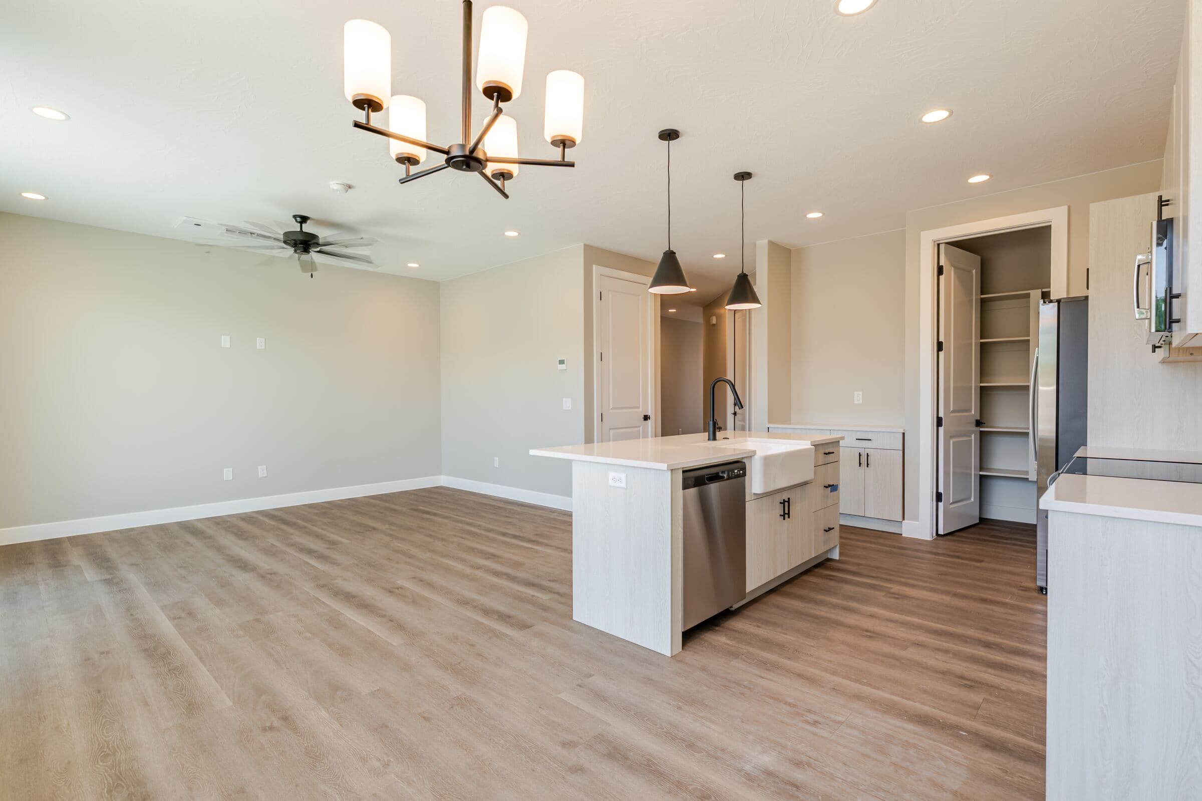 Open great room and dining area with vaulted ceiling